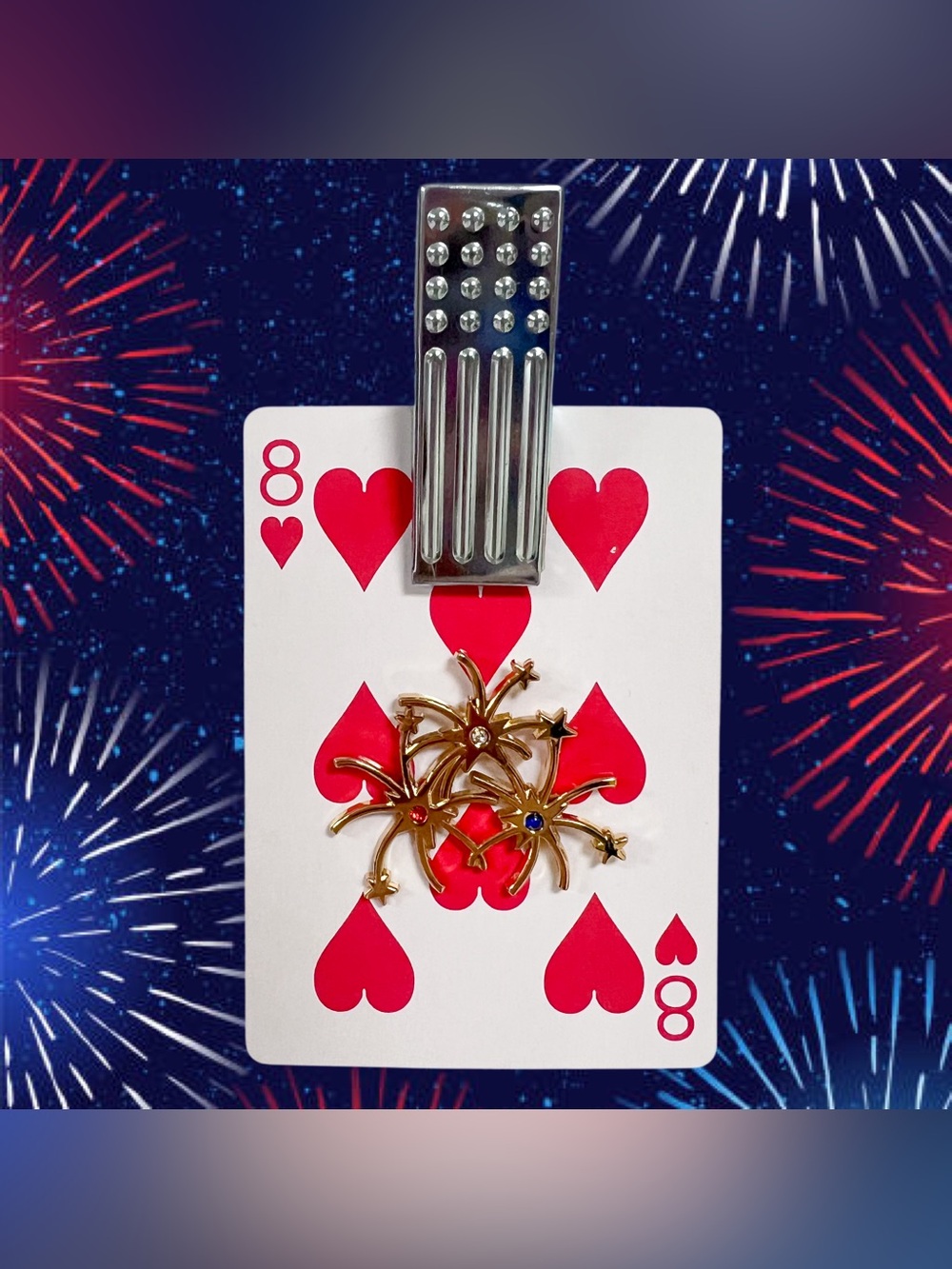Vintage gold fireworks brooch with red white and blue crystals